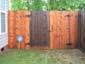 Cedar fence during cleaning process
