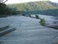 Deck sealed with driftwood grey tinted sealer to blend with rocks